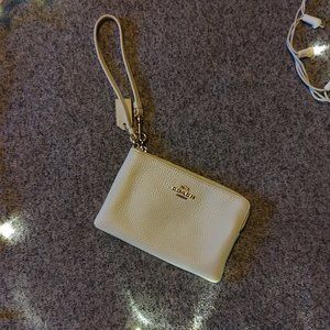 Coach cream pebbled leather wristlet